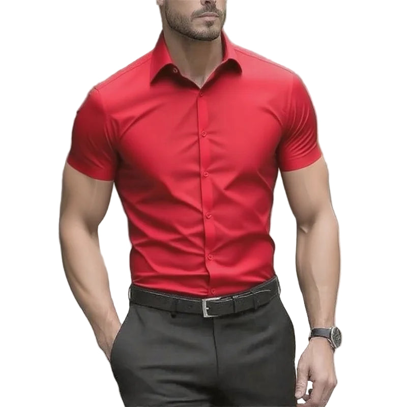Man wearing a red short-sleeve shirt and black pants outdoors